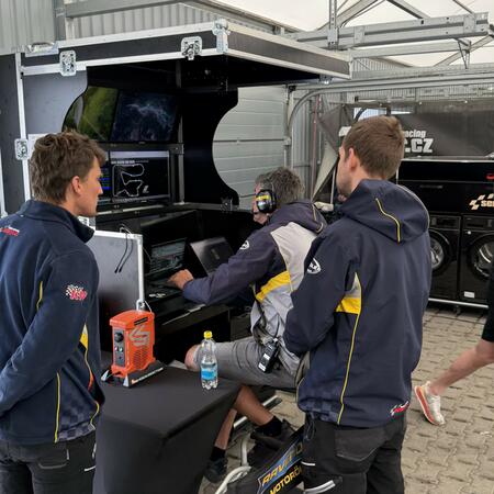 R. Šenkýř and the technicians are monitoring the cars' live...
