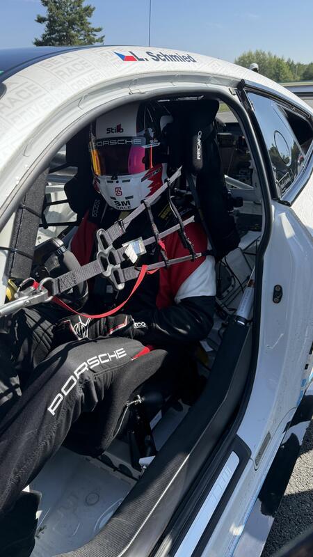 L. Schmied at the wheel of a BMW M4 GT4 racing car