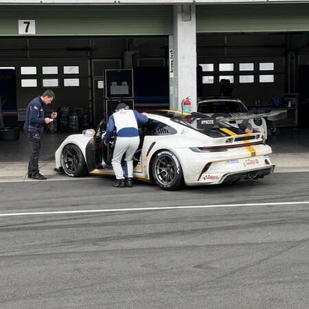 P. Bouška drives through the chicane as he enters the pit...