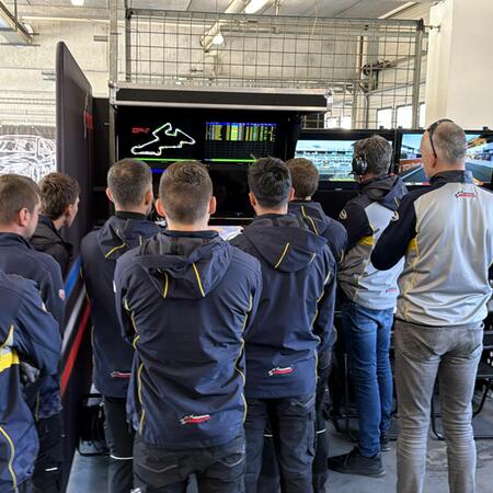 Technicians and coaches are monitoring the first qualifying...