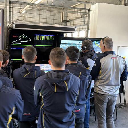 Technicians and coaches are monitoring the first qualifying...