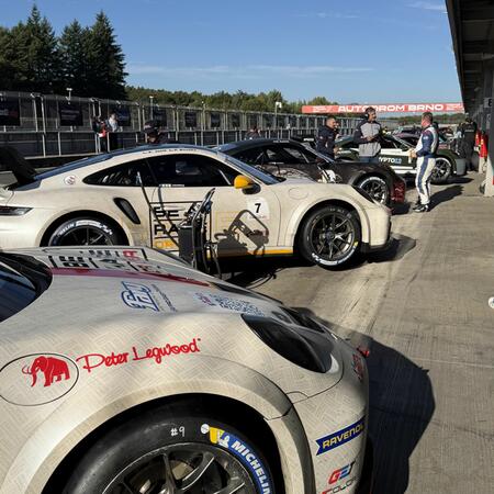 Views of the cars in front of the pit boxes between qualifying...