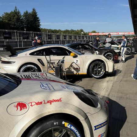 Views of the cars in front of the pit boxes between qualifying...