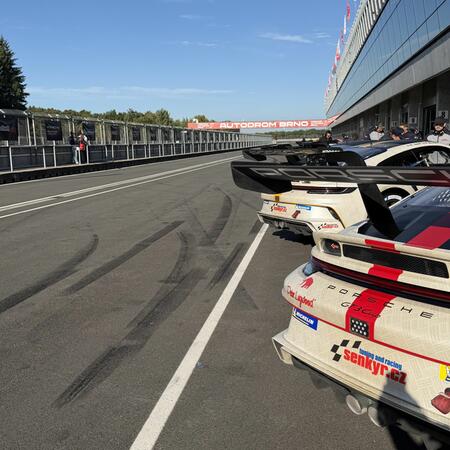 Views of the cars in front of the pit boxes between qualifying...