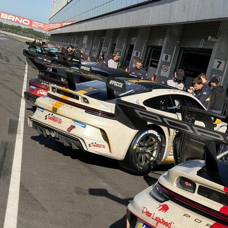 Views of the cars in front of the pit boxes between qualifying...