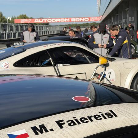 Views of the cars in front of the pit boxes between qualifying...