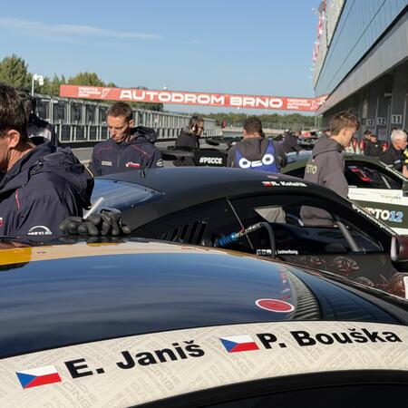 Views of the cars in front of the pit boxes between qualifying...