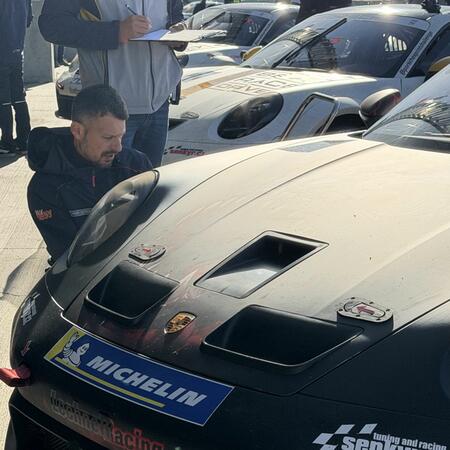 Views of the cars in front of the pit boxes between qualifying...