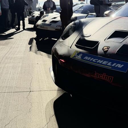 Views of the cars in front of the pit boxes between qualifying...