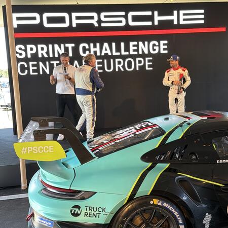 Pavel Bouška receives the trophy for second place in the...