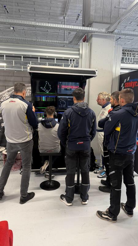 Coaches and engineers monitor the progress of the training...