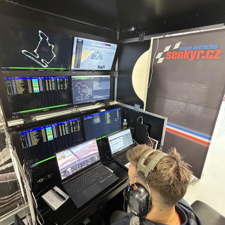 Coaches and engineers monitor the progress of the training...