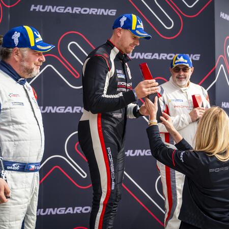 Pavel Bouška receives the trophy for second place in the...