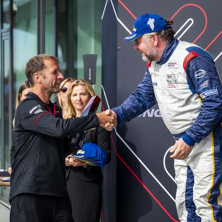 Pavel Bouška receives the trophy for second place in the...